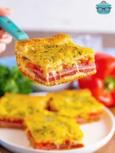 Spatula holding up one Italian Sub Square.