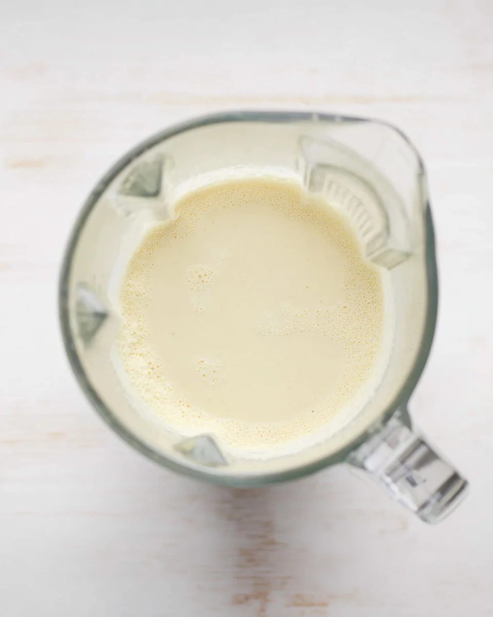 tapioca flour, Parmesan and mozzarella cheese, salt, and baking powder combined with egg/milk mix in blender pitcher tapioca flour, Parmesan and mozzarella cheese, salt, and baking powder combined with egg/milk mix in blender pitcher