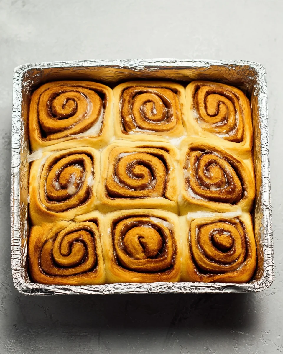 baked cinnamon rolls in baking pan