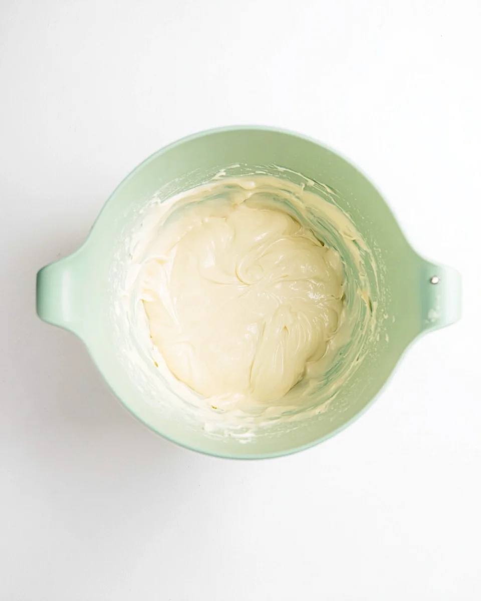 cream cheese frosting made in a bowl. cream cheese frosting made in a bowl.