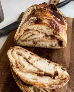 sliced cinnamon sourdough bread on cutting board.