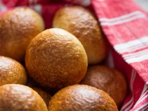 Close up view of dinner rolls in a basket.