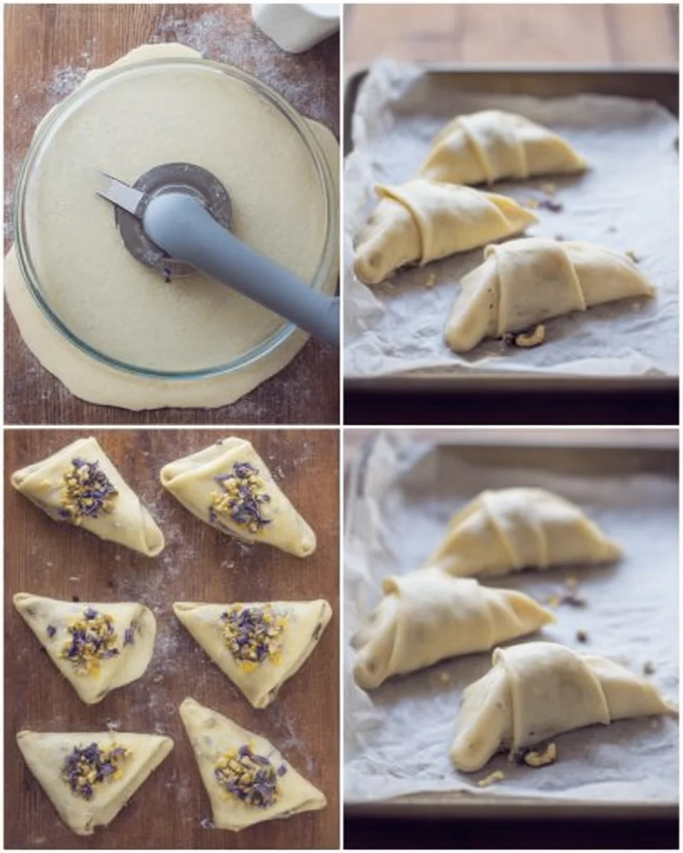 Dough rolled & cut, stuffed to form crescents, ready for baking on a cookie sheet.