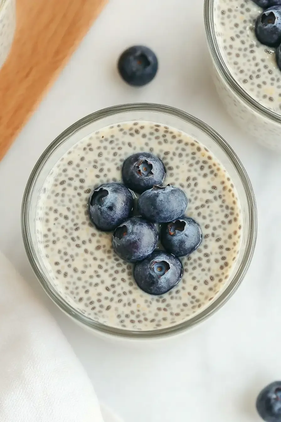 Earl Grey Chia Seed Pudding Creamy vegan chia seed pudding topped with fresh blueberries, infused with Earl Grey tea flavor.