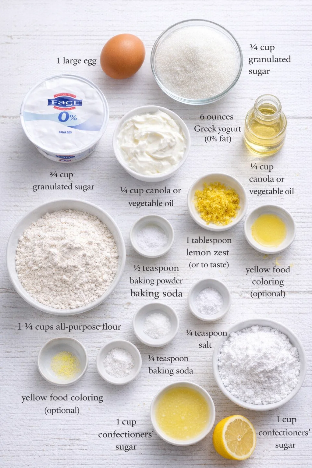 Measured ingredients arranged for Baked Lemon Donuts with Lemon Glaze: 1 large egg, ¾ cup granulated sugar, 6 ounces Greek yogurt (I used 0% fat Fage; sour cream may be substituted), ¼ cup canola or vegetable oil, 1 tabl