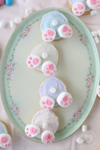 Bunny Butt Cookies are frosted Easter cookies that feature little bunny paws made with marshmallows and a little white marshmallow tail.