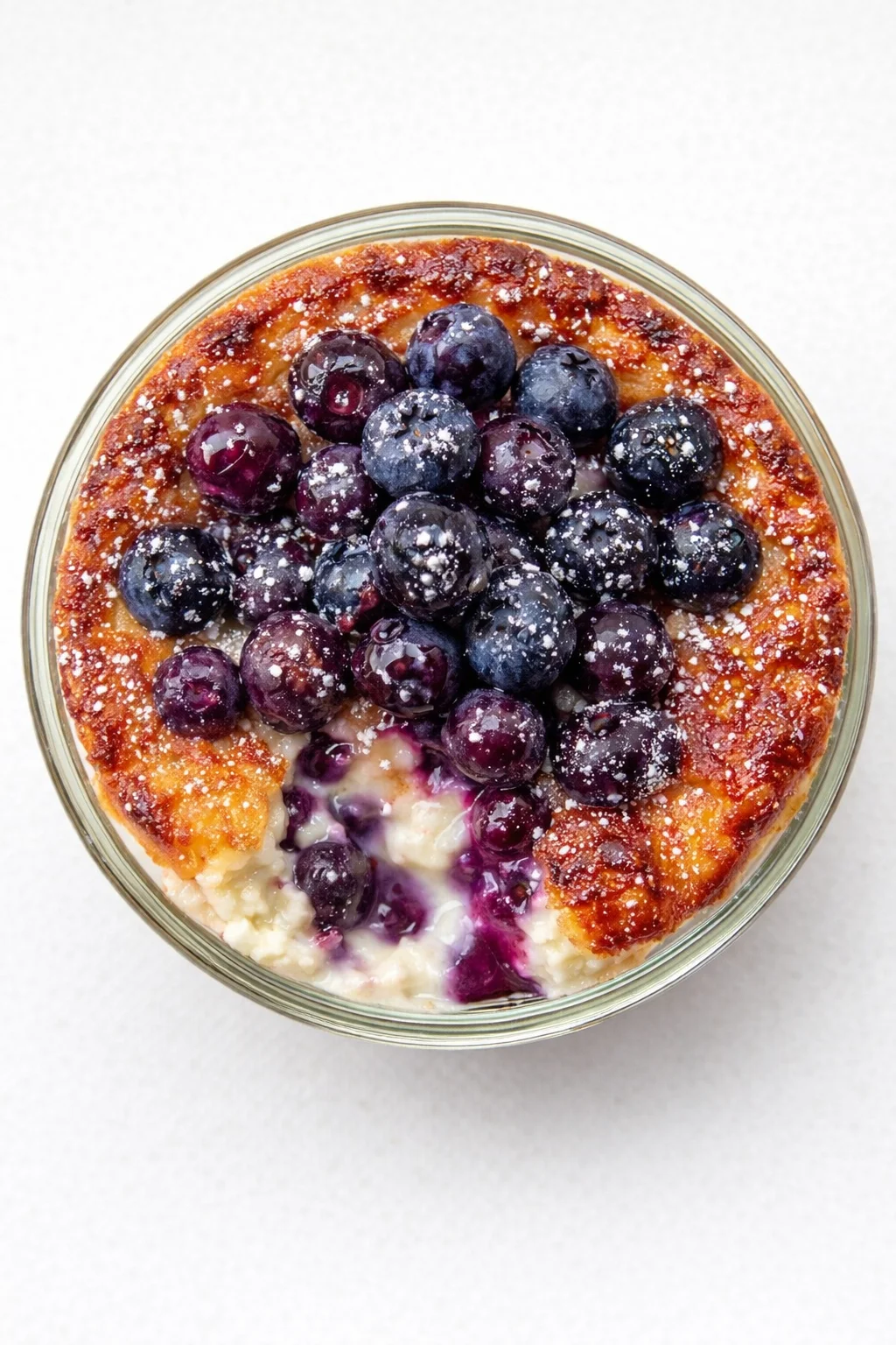 Straight-down overhead view of Baked Blueberry Cottage Cheese Breakfast Bowls
