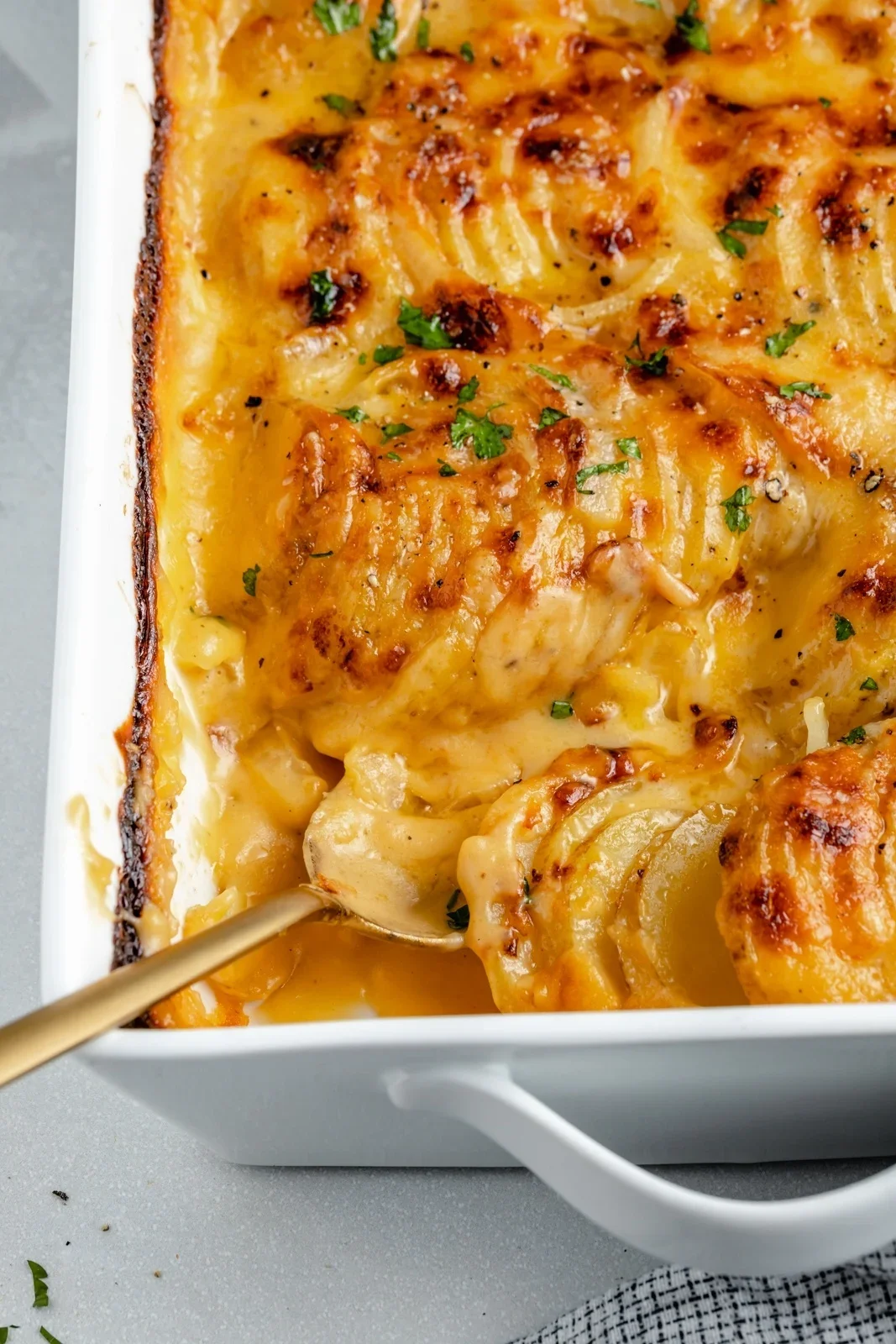 Creamy, cheesy au gratin potatoes layered and baked to golden perfection.
