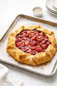 Rustic rhubarb strawberry galette with flaky crust and jammy fruit filling