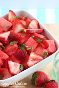 Fresh strawberry and watermelon salad with mint and honey drizzle.