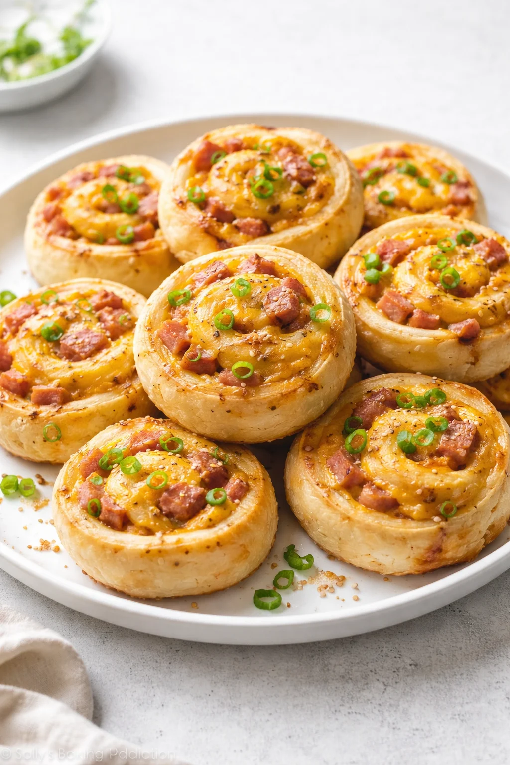 Final plated Easter Ham and Cheddar Pinwheels served as a hero shot