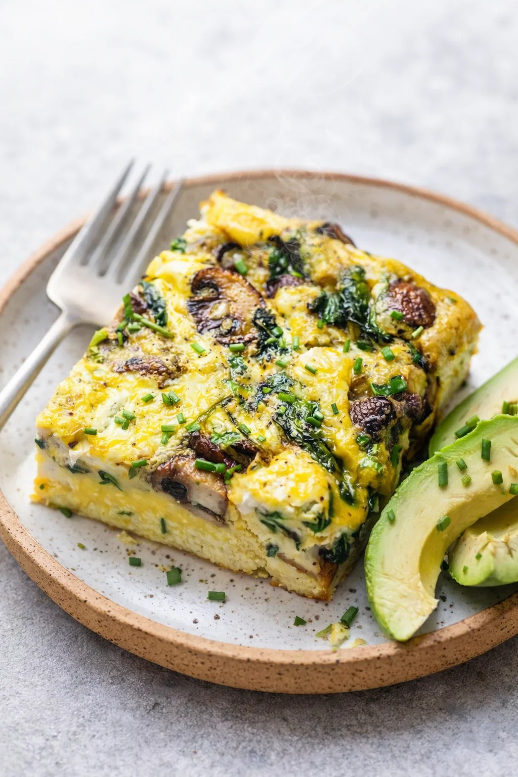 Final plated Spinach Mushroom Breakfast Casserole served as a hero shot