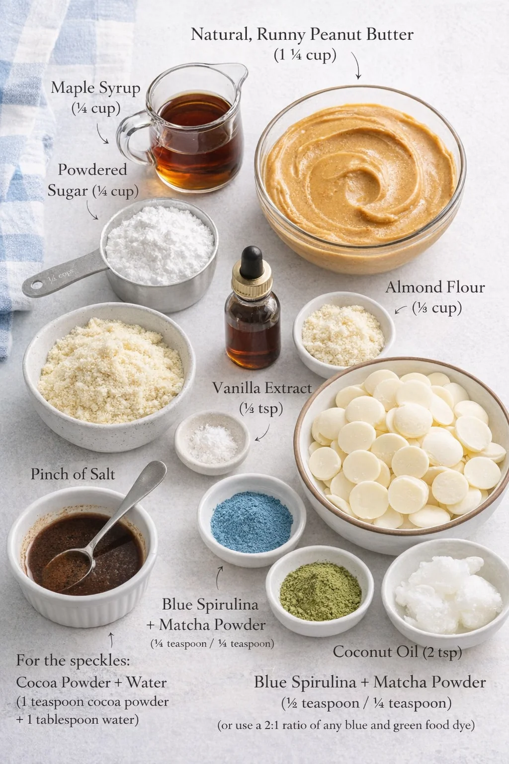 Measured ingredients arranged for Peanut Butter Easter Eggs: 1 ¼ cup natural, runny peanut butter (no sugar added), ¼ cup maple syrup, ¼ cup powdered sugar, ⅓ cup almond flour, ½ teaspoon vanilla extract, Pinch of salt