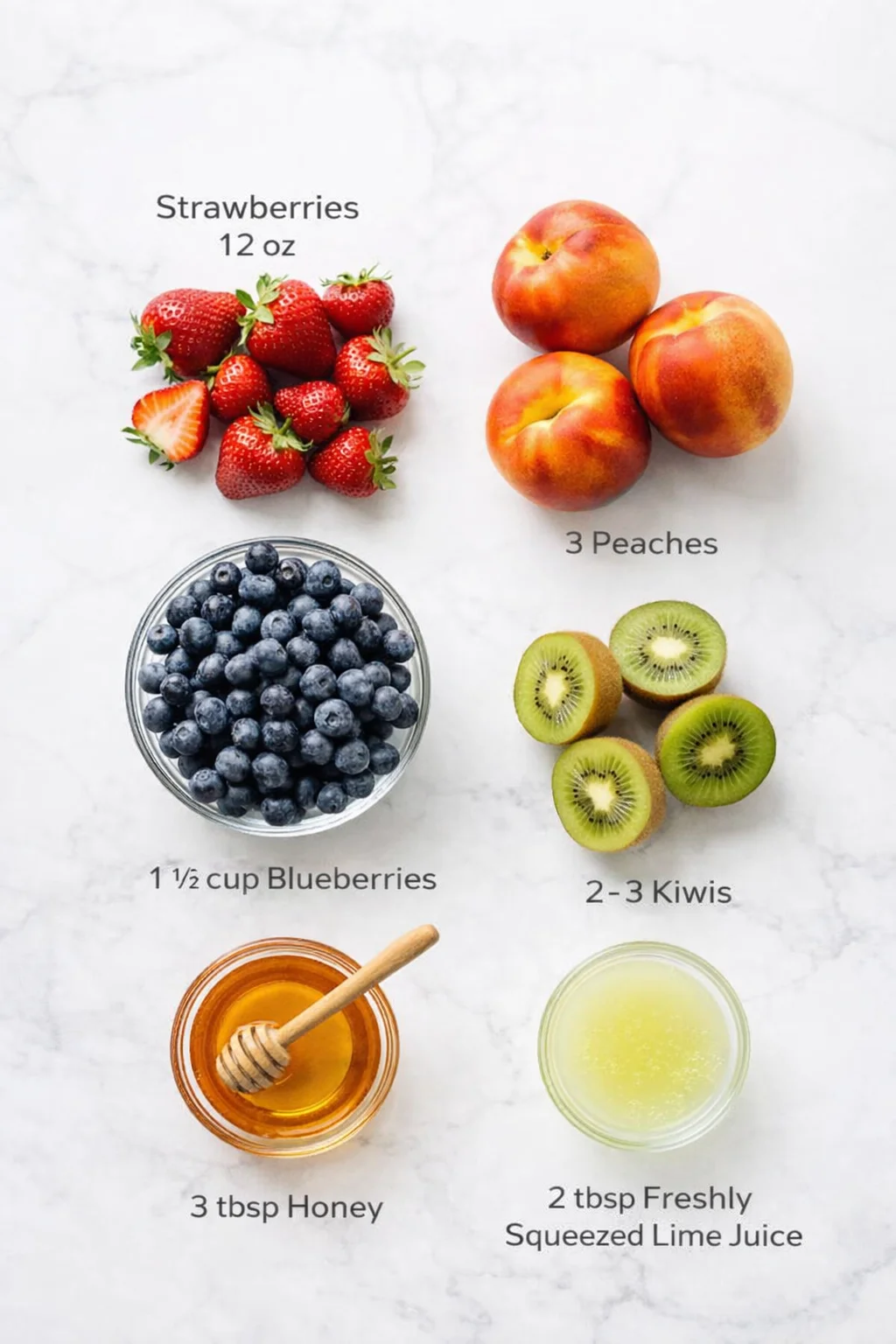 Measured ingredients arranged for Fruit Salad with Honey Lime Dressing: 12 oz strawberries, 3 peaches, 1 1/2 cup blueberries, 2-3 kiwis, 3 tbsp honey, 2 tbsp freshly squeezed lime juice