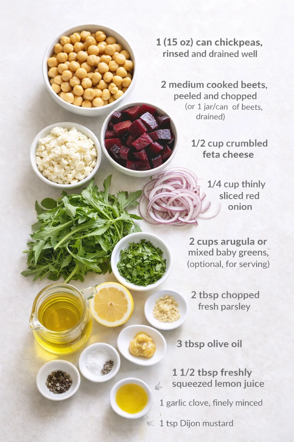 Measured ingredients arranged for Chickpea, Beet & Feta Salad with Lemon-Garlic Vinaigrette: 1 (15 oz) can chickpeas, rinsed and drained well, 2 medium cooked beets, peeled and chopped (or 1 jar/can of beets, drained), 1