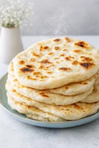 Final plated Fluffy Greek Pita served as a hero shot