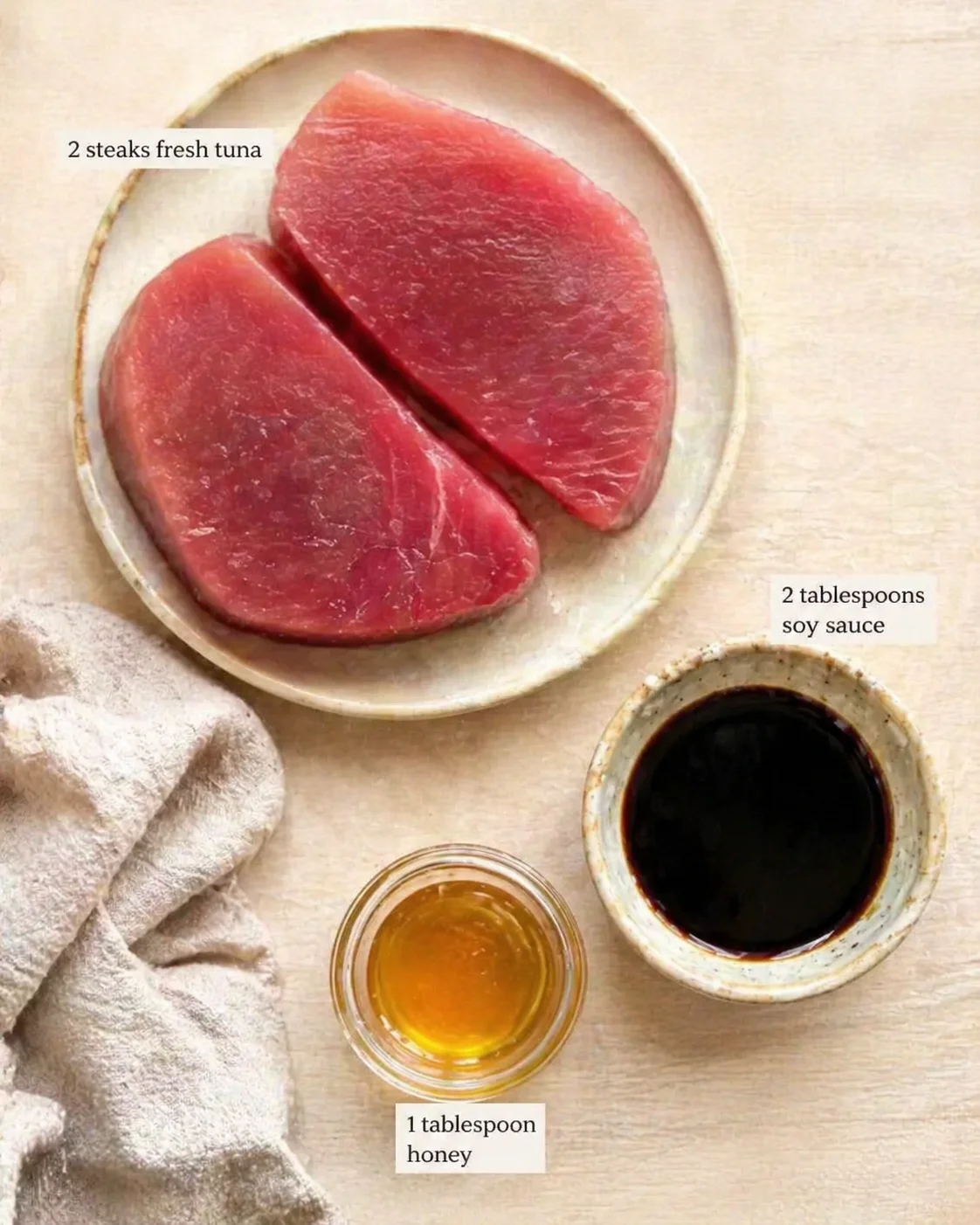 Measured ingredients arranged for Juicy Pan-Seared Tuna Steaks with Soy Glaze in Just 4 Minutes: 2 steaks fresh tuna — choose high-quality, sushi-grade for the best flavor and texture, 2 tablespoons soy sauce — adds savo