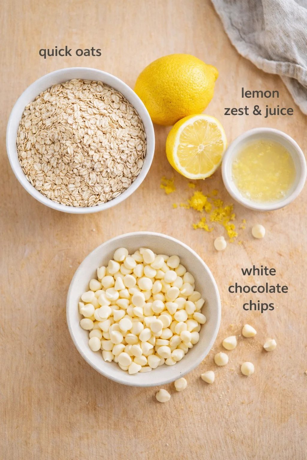 Measured ingredients arranged for Lemon Oatmeal No-Bake Cookies: Quick oats, One ripe lemon (zest and juice), White chocolate chips