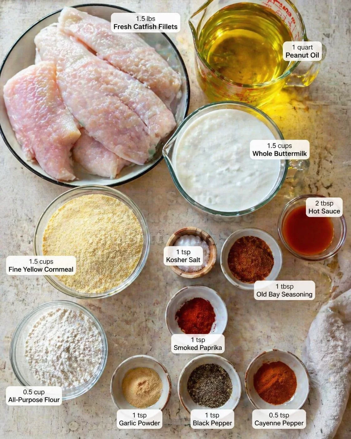 Measured ingredients arranged for Southern Fried Catfish for 4 Servings - Food Revealer: 1.5 lbs Fresh Catfish Fillets, 1.5 cups Whole Buttermilk, 2 tbsp Hot Sauce, 1 tsp Kosher Salt, 1.5 cups Fine Yellow Cornmeal, 0.5 c