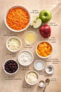 Top-down view of colorful ingredients laid out on a wooden board for a recipe.
